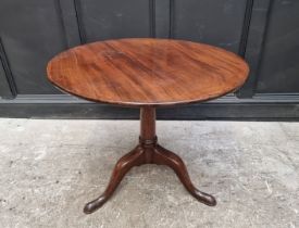 A George III mahogany circular tilt-top tripod table, with one-piece top and birdcage action, 80cm