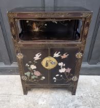 A modern Chinese black lacquered and soapstone side cabinet, 61cm wide.