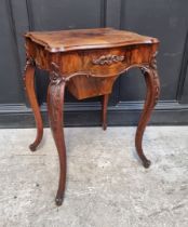A 19th century continental mahogany work table, the hinged top enclosing an arrangement of pigeon