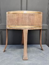 A large 19th century oak and brass bound oval wine cooler, the top 65cm wide.