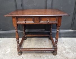 An early 18th century oak single drawer side table, 81cm wide, (feet replaced).