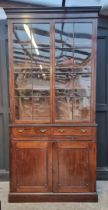 A large early 19th century mahogany bookcase, 259.5 high x 128cm wide, (faults).