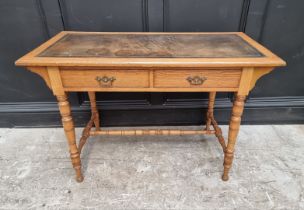 An Edwardian oak desk, 106.5cm wide.