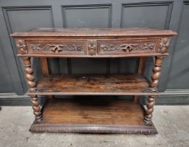 A late Victorian carved oak three tier buffet, 120cm wide.