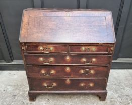 An 18th century oak bureau, 92cm wide.