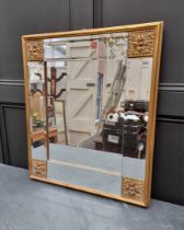 A gilt gesso framed wall mirror, 73.5 x 63.5cm.