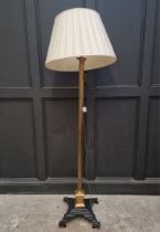 A brass and cast iron Corinthian column standard lamp, height excluding fitting 158cm.
