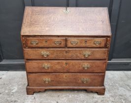 An 18th century oak bureau, 91.5cm wide.