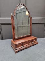 A George III mahogany and crossbanded toilet mirror, 47cm wide.