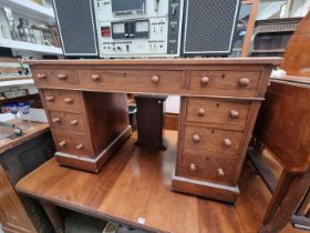 An early 20th century walnut pedestal desk, 122cm wide.