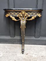 A neo-classical style ebonized, parcel gilt and marble top console table, 78.5cm wide.