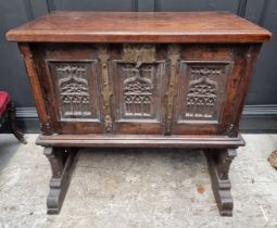 A 16th century and later oak side cabinet, with fall front and trestle supports, 91cm wide.