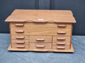 A reproduction oak jewellery chest, 45cm wide.