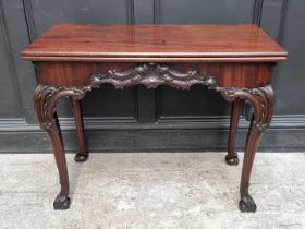 A good 19th century carved mahogany concertina action tea table, probably Irish, 91cm wide.