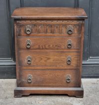 A small reproduction oak chest, 57.5cm wide.