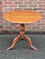 A Victorian mahogany and ash circular tilt top tripod table, 75cm diameter.