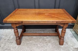 A reproduction oak draw leaf refectory table, 136.5cm when closed; together with a matching side