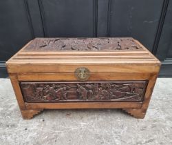 A Chinese carved camphor wood coffer, 91.5cm wide.