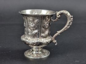 A William IV silver repousse mug, by J.K., London 1835, 9.5cm high, weighted.