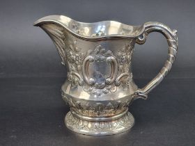 An Edwardian silver repousse jug, by George Nathan & Ridley Hayes, Chester 1904, 15.5cm high, 433g.