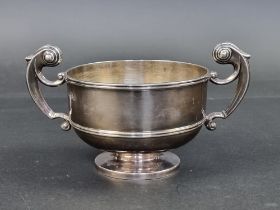 An Edwardian silver twin handled trophy cup, by George Nathan & Ridley Hayes, Chester 1909, 9.5cm