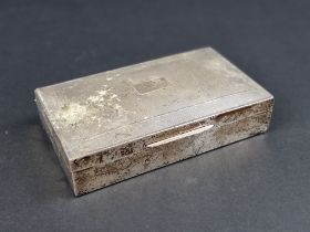 A silver engine turned cigarette box, by Harman Brothers, Birmingham 1951, 15cm wide.