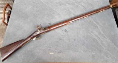 A 'Brown Bess' musket, with 38in smooth barrel with tower lock, (missing sling mounts), brass butt