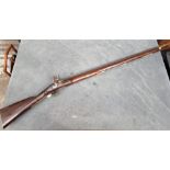 A 'Brown Bess' musket, with 38in smooth barrel with tower lock, (missing sling mounts), brass butt