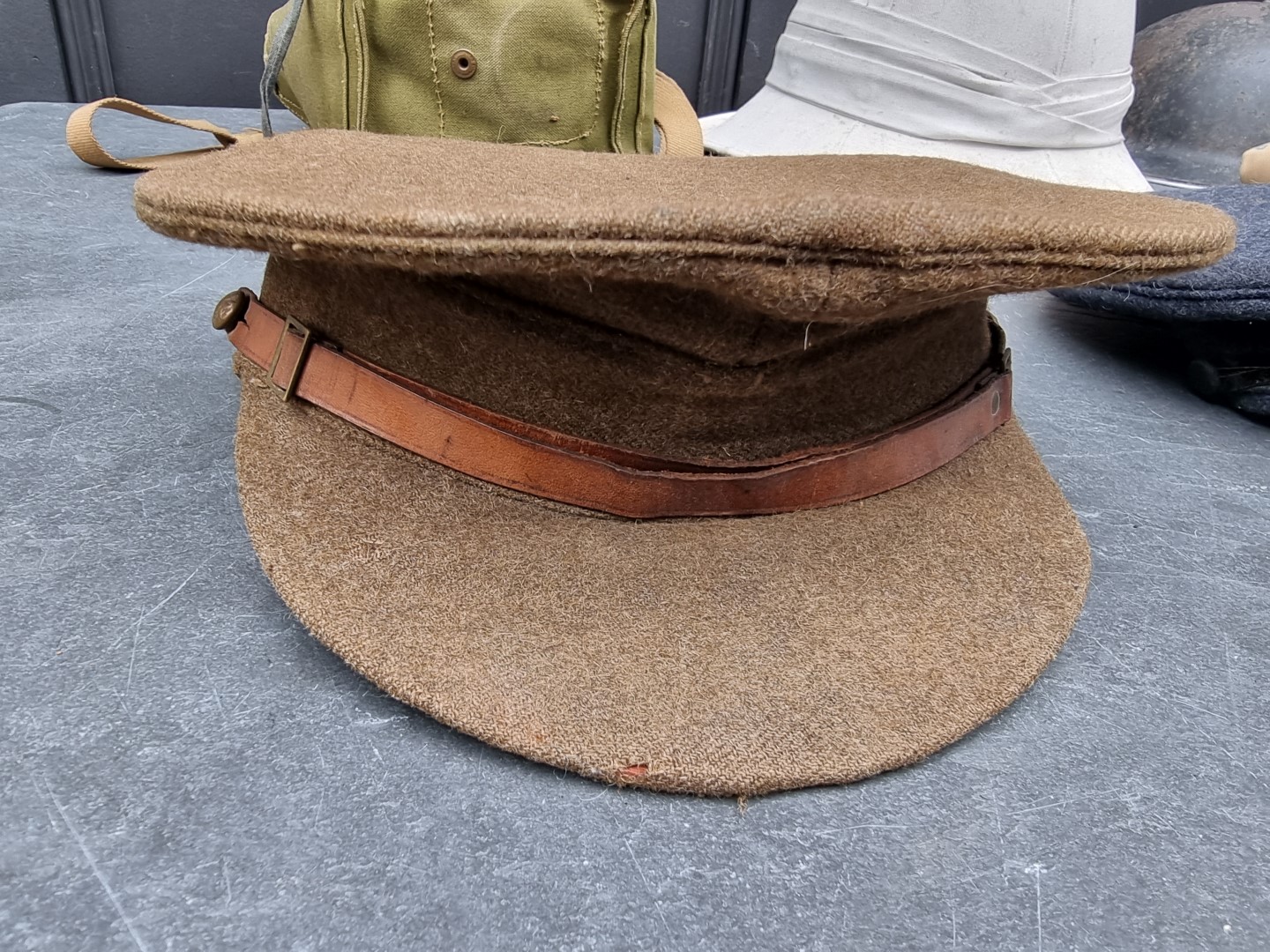 A group of militaria; comprising a British gas mask, dated 1943; an RAF officer's peaked cap; an ARP - Image 6 of 7