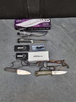 A set of Hibben 'Large Triple Thrower GH455C' knives and sheaths, having 11cm blades, boxed;