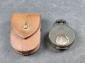 A WWI compass, by Negretti & Zambra, 54mm diameter, in leather case.