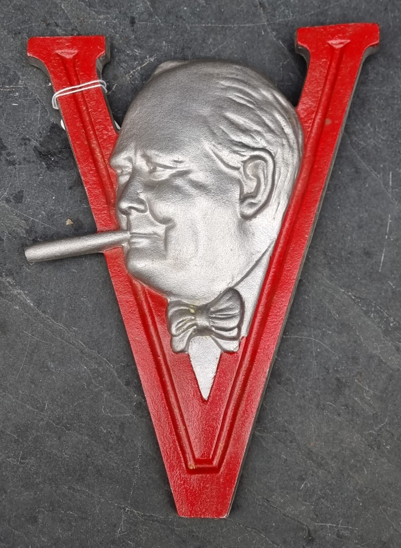 A post-war painted aluminium Winston Churchill V for Victory sign, 29.5cm high.