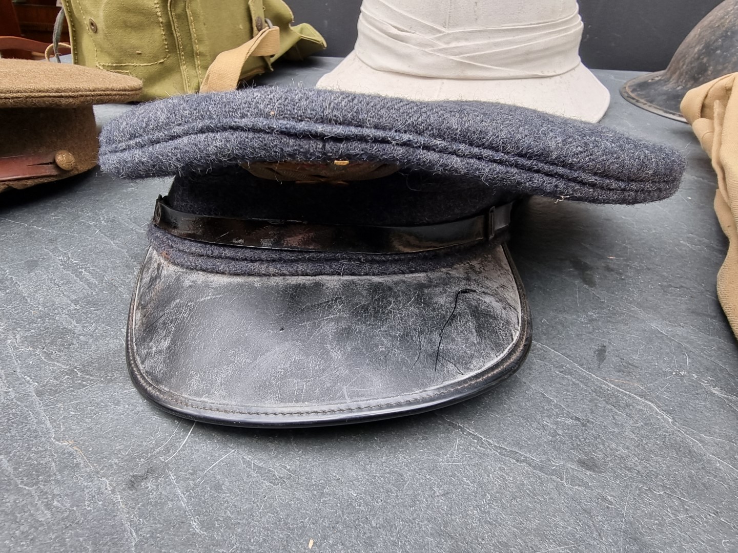 A group of militaria; comprising a British gas mask, dated 1943; an RAF officer's peaked cap; an ARP - Image 5 of 7