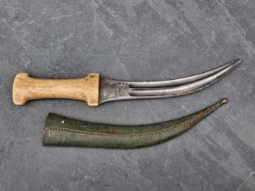 A Persian khanjar dagger and sheath, having curved 20cm blade, with bone hilt, the base of the blade