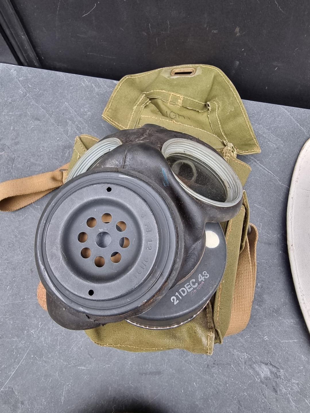 A group of militaria; comprising a British gas mask, dated 1943; an RAF officer's peaked cap; an ARP - Image 7 of 7