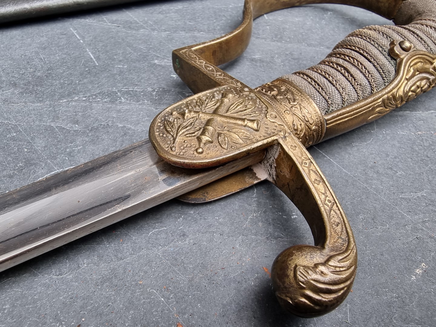 A German Imperial officer's lionhead sabre and steel scabbard, having 76cm fullered blade. - Image 6 of 7