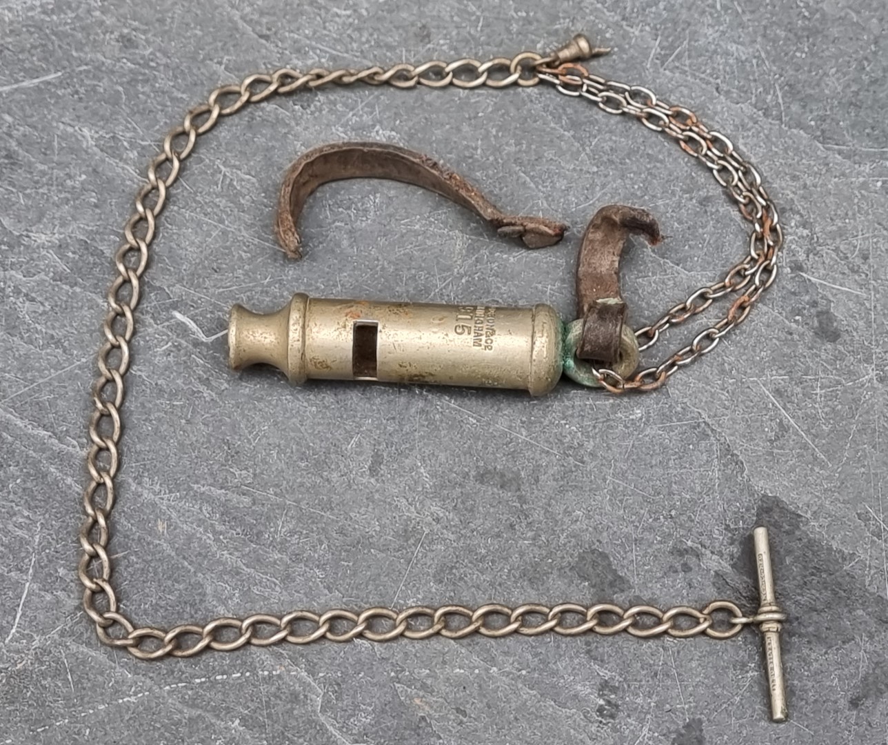 A WWI British military trench whistle, by Hudson, dated 1915.