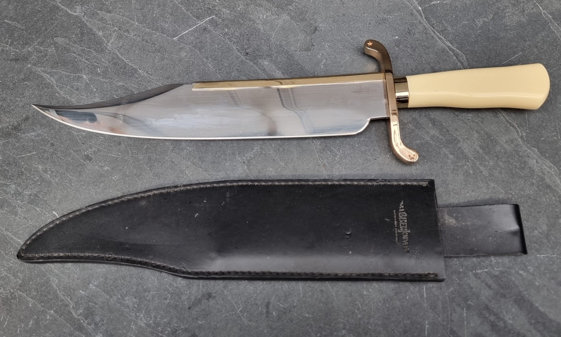 A Hibben GH517 Bowie knife and sheath, having 35cm blade.
