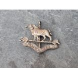 A rare Colonial Equatorial Corps (Sudan Defence Force) cast silver Officer's cap badge, by