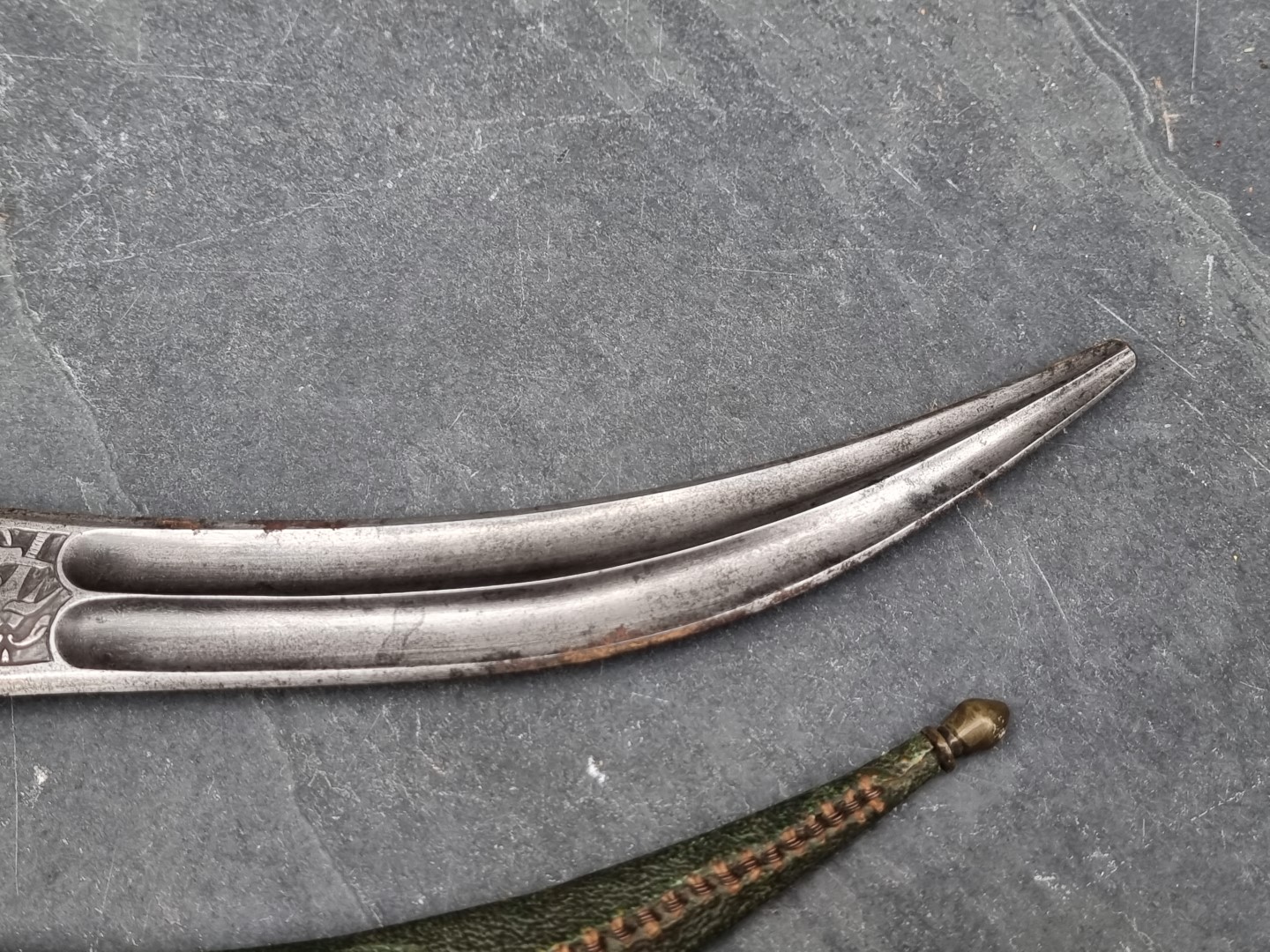 A Persian khanjar dagger and sheath, having curved 20cm blade, with bone hilt, the base of the blade - Image 3 of 9