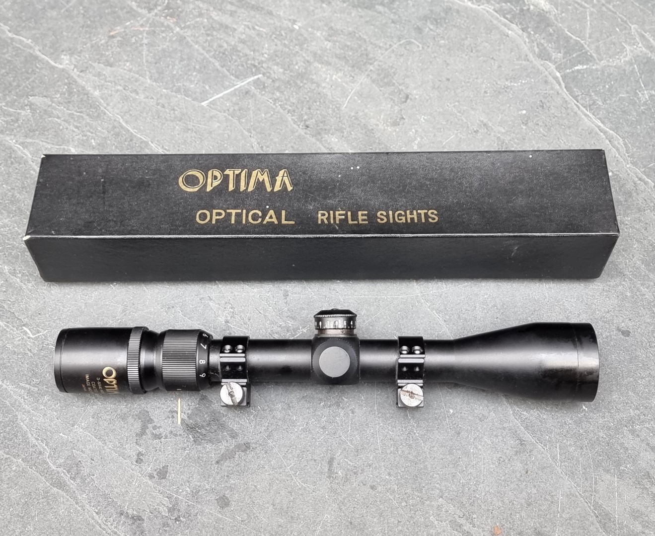 An Optima 3.9 X 40 rifle sight, boxed.