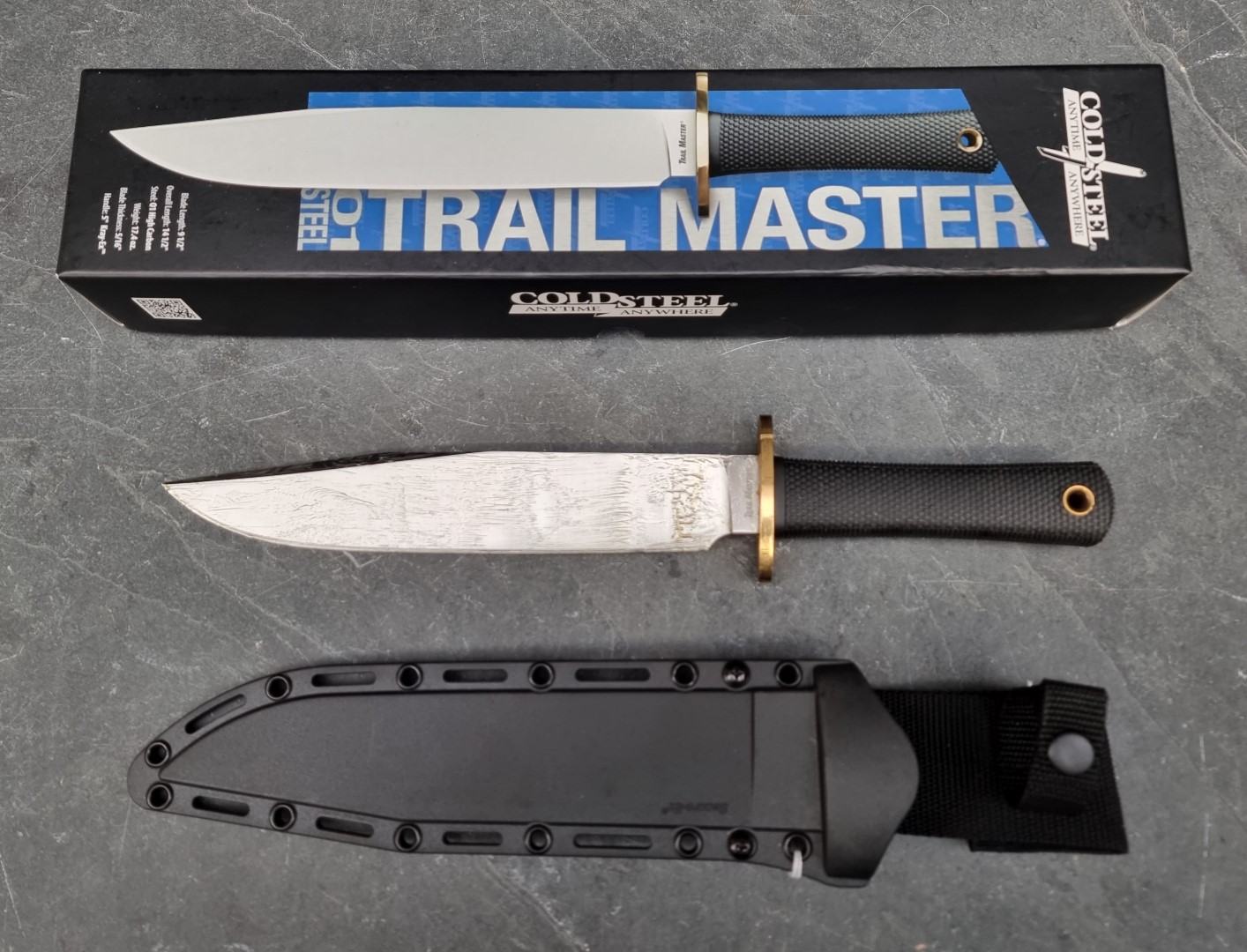 A Cold Steel 'Trail Master O1' Bowie knife and sheath, having 24cm blade, boxed.