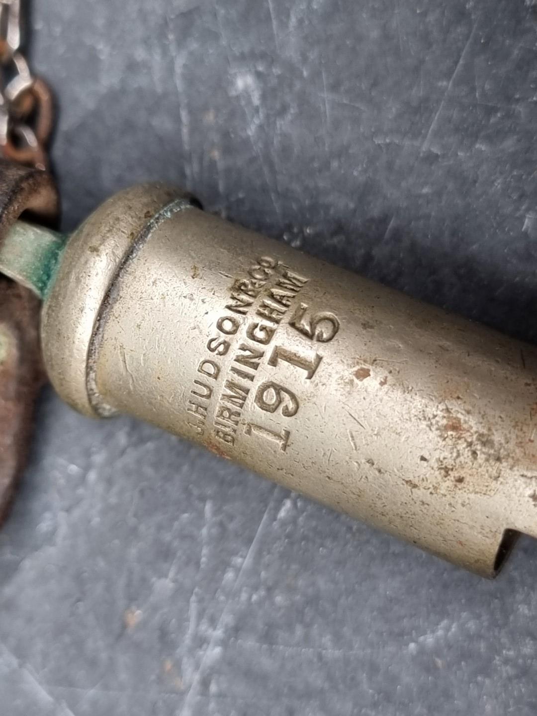 A WWI British military trench whistle, by Hudson, dated 1915. - Image 2 of 3
