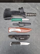 A set of Hibben 'Large Triple Thrower GH455C' knives and sheaths, having 11cm blades; together