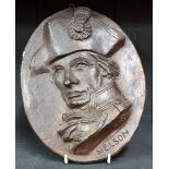 A painted plaster oval plaque of Admiral Lord Nelson, 26cm high