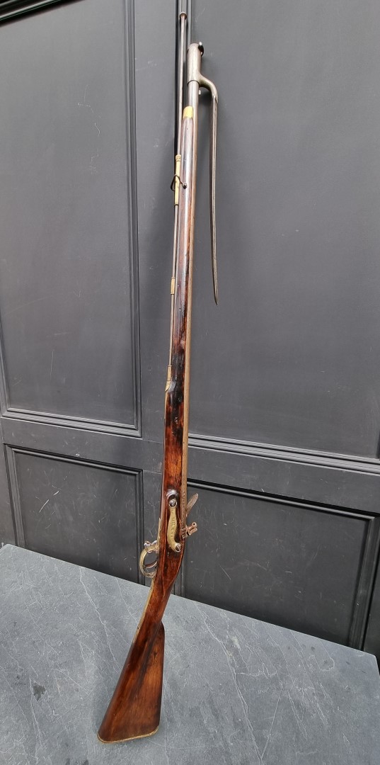 A 'Brown Bess' musket, with 38in barrel, tower marked lock and bayonet, barrel and lock both