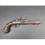 A fine early 19th century Irish duelling pistol, with relief cast 8in barrel and brass fittings,