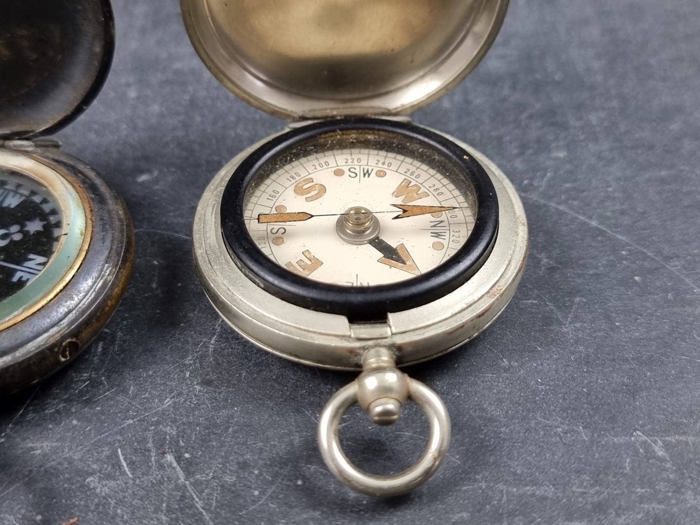 Two WWI military style nickel plated compasses; together with two other pocket compasses. (4) - Image 5 of 5