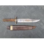 A Victorian Bowie knife and sheath, with 22.5cm steel blade marked 'J. Rodgers & Co, No.6 Norfolk