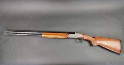 An Emilio Rizzini double barrel over and under 12 bore shotgun, made in Italy, Serial No.27455.